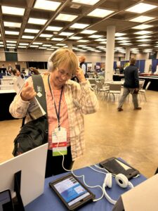 A short-haired woman listens to the Introduced Podcast