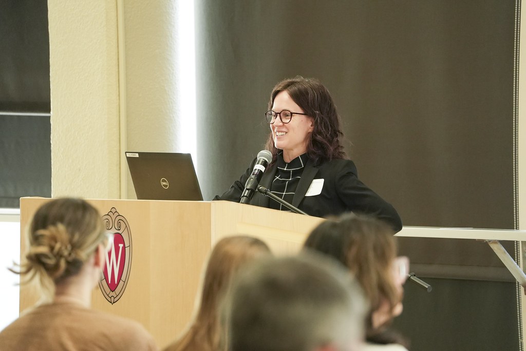 Tressie Kamp addresses audience from podium